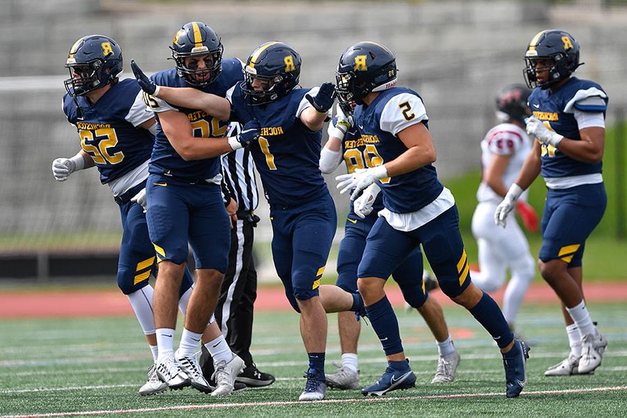 U of R football players on the field.