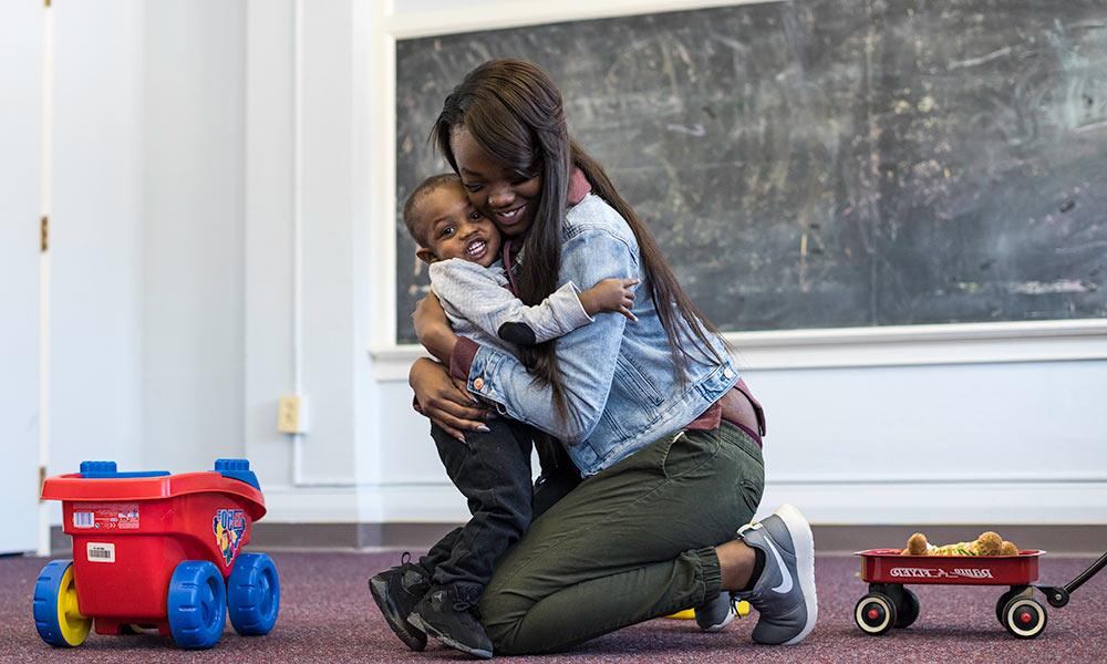 Laianna Baker and son Corey playing at the Mt. Hope Family Center